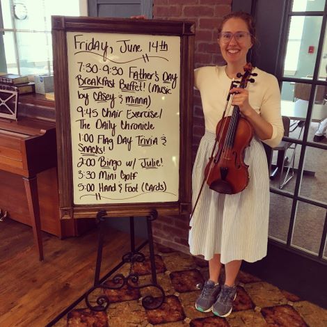 Senior Living musician Minna Biggs plays her fiddle at the Senior Living Father's Day Celebration.