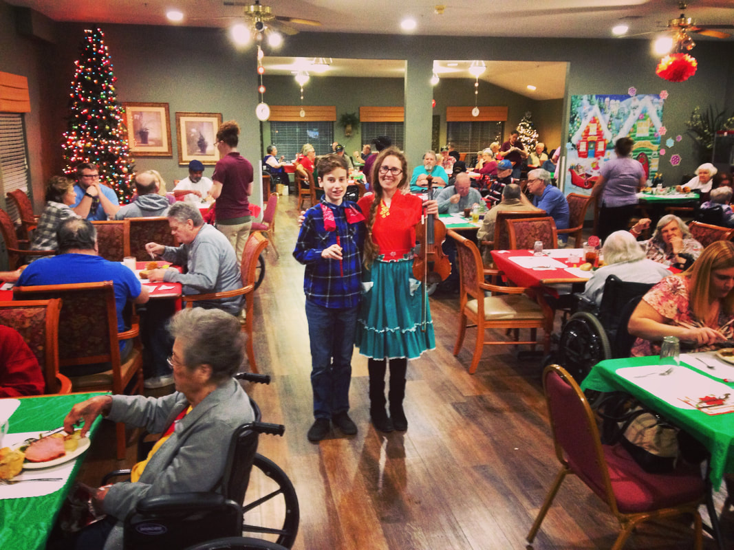 Picture, Senior Living, August Biggs, Minna Biggs, Fiddle, violin, guitar, family night, holiday party