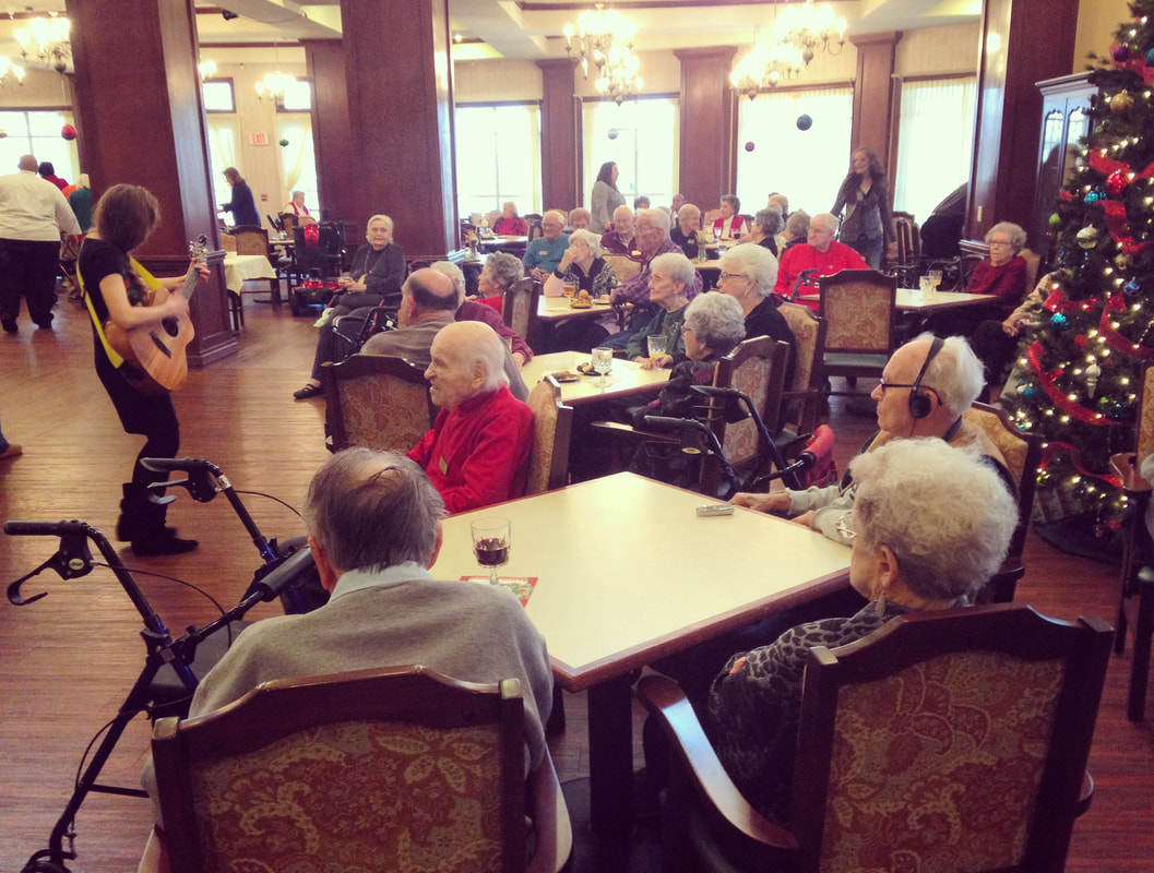 Picture, Minna Biggs, Senior Living, Oklahoma City, Christmas Music, Holiday Party, Acoustic Guitar, live music